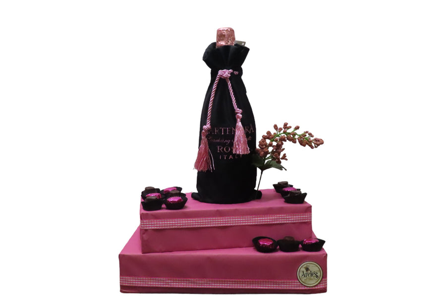 Bartenura kosher wine on pink gift arrangement. Corporate gifting. Baby girl gift.
